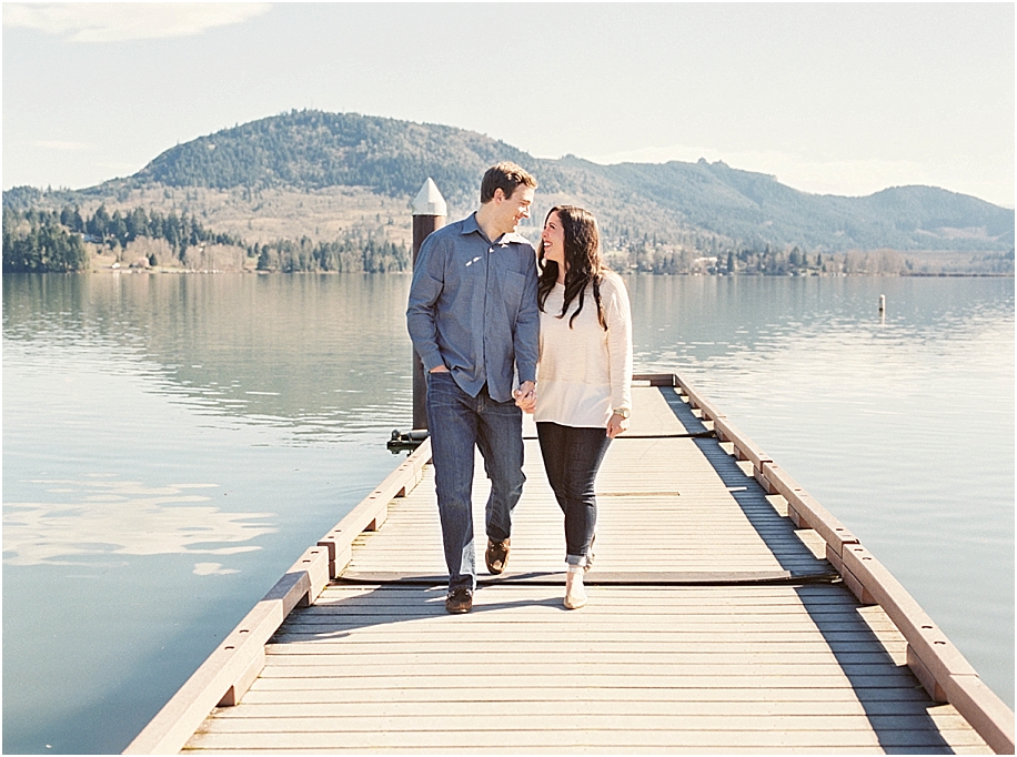 couple-walking-on-dock-oregon-lakeside-engagement