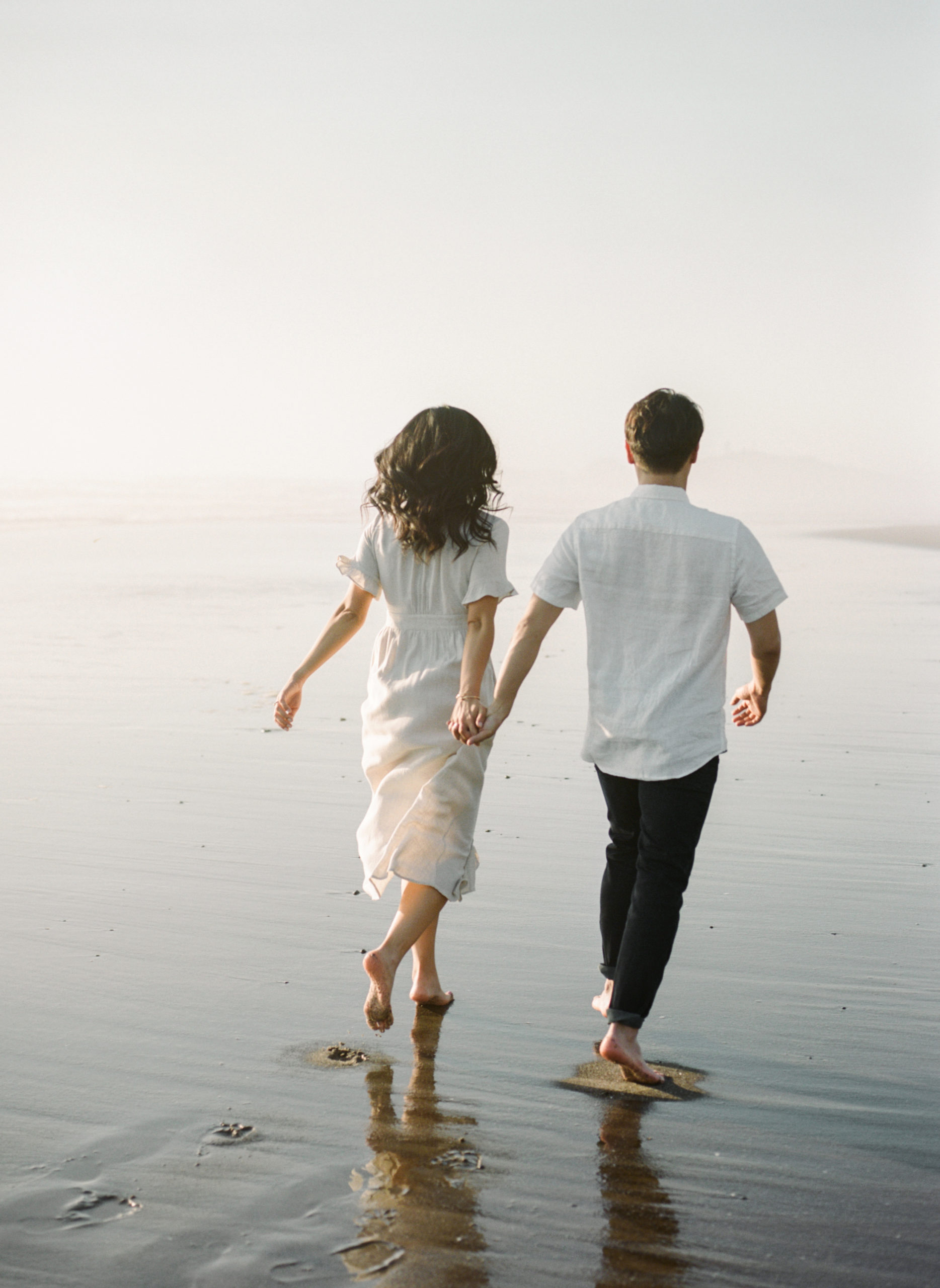 couple-walking-along-the-beach